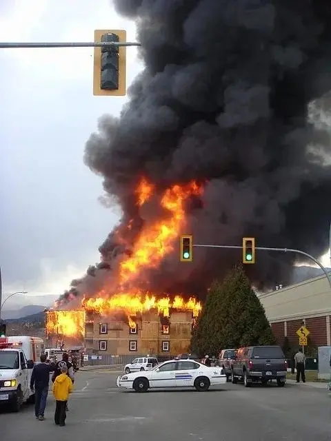 Building engulfed in smoke and fire.