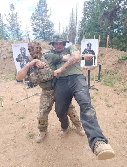 Two man fighting at the shooting sport